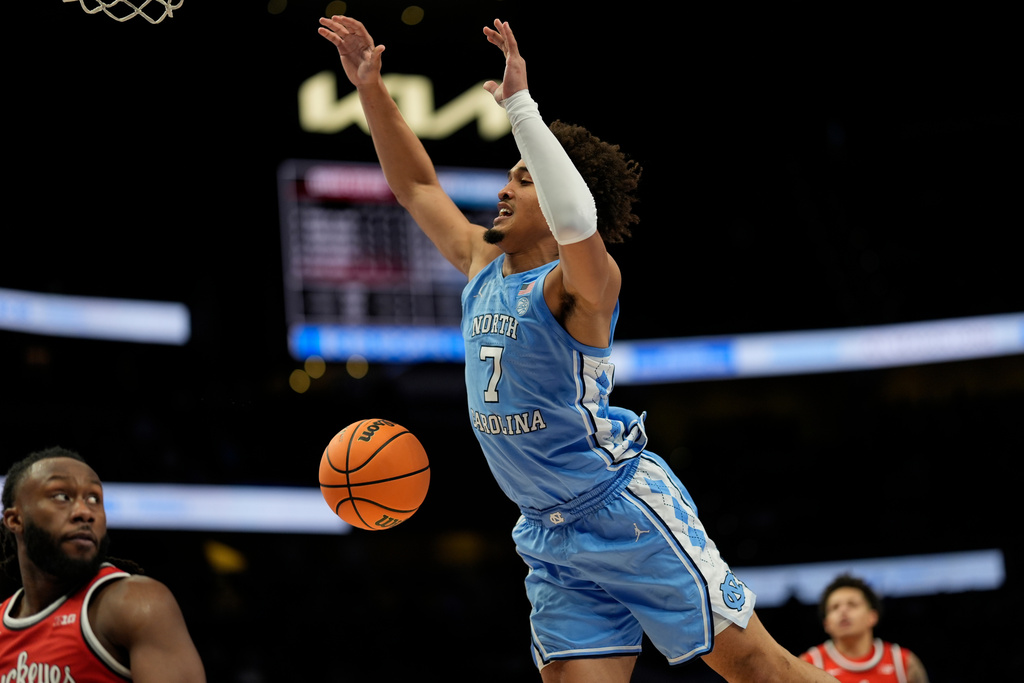 North Carolina guard Seth Trimble (7) loses the ball against Ohio State during the second half of an NCAA basketball game, Saturday, Dec. 20, 2025, in Atlanta. (AP Photo/Mike Stewart)