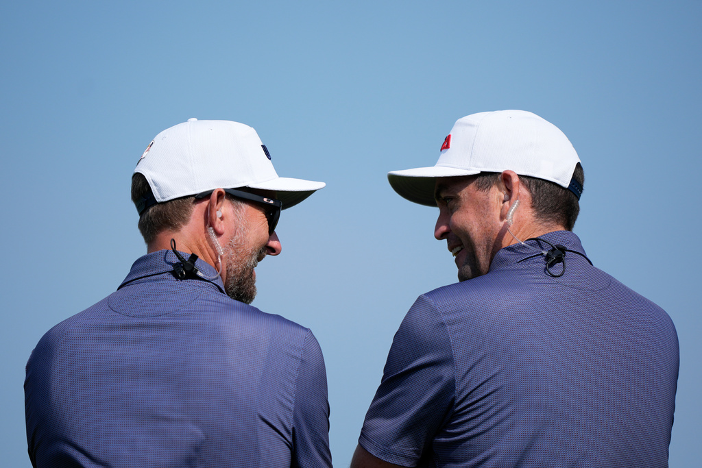 United States Captain Keegan Bradley and Webb Simpson watch during a practice round for the Ryder Cup golf tournament, Tuesday, Sept. 23, 2025, in Farmingdale, N.Y., at Bethpage State Park's Black Course. (AP Photo/Robert Bukaty)