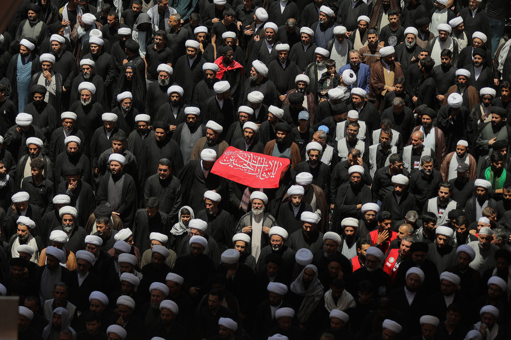 Shiite clerics join other mourners during the funeral procession for the late Iranian Supreme Leader Ayatollah Ali Khamenei inside the Imam Ali Shrine in Najaf, Iraq, Wednesday, July 8, 2026. (AP Photo/Anmar Khalil)