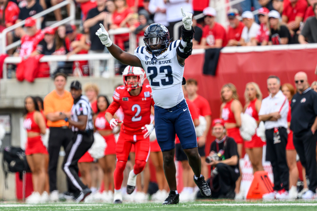 Utah State defensive lineman BJ Diakite (23) celebrates after a tackle for a loss during the first half of an NCAA college football game against Utah, Saturday, Sept. 19, 2026, in Salt Lake City. (AP Photo/Tyler Tate)
