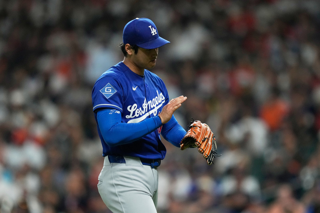 Los Angeles Dodgers starting pitcher Shohei Ohtani returns to the dugout after the top of the third inning of a baseball game against the Houston Astros in Houston, Tuesday, May 5, 2026. (AP Photo/Ashley Landis)