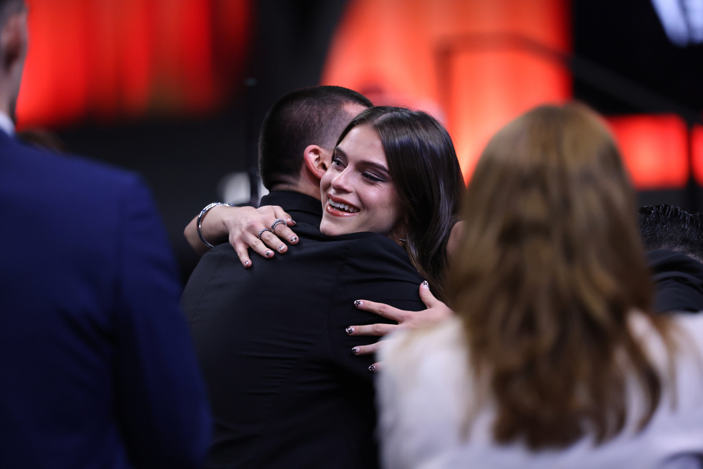 UCLA guard Gabriela Jaquez hugs family after being selected fifth overall by the Chicago Sky in the first round of the WNBA basketball draft Monday, April 13, 2026, in New York. (AP Photo/Pamela Smith)