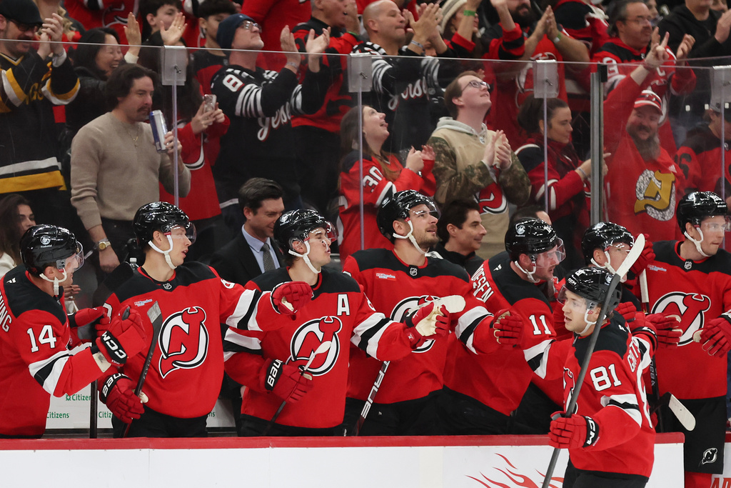 New Jersey Devils right wing Arseny Gritsyuk (81) celebrates with teammates after scoring a goal during the first period of an NHL hockey game against the Pittsburgh Penguins, Saturday, Nov. 8, 2025, in Newark, N.J. (AP Photo/Heather Khalifa)