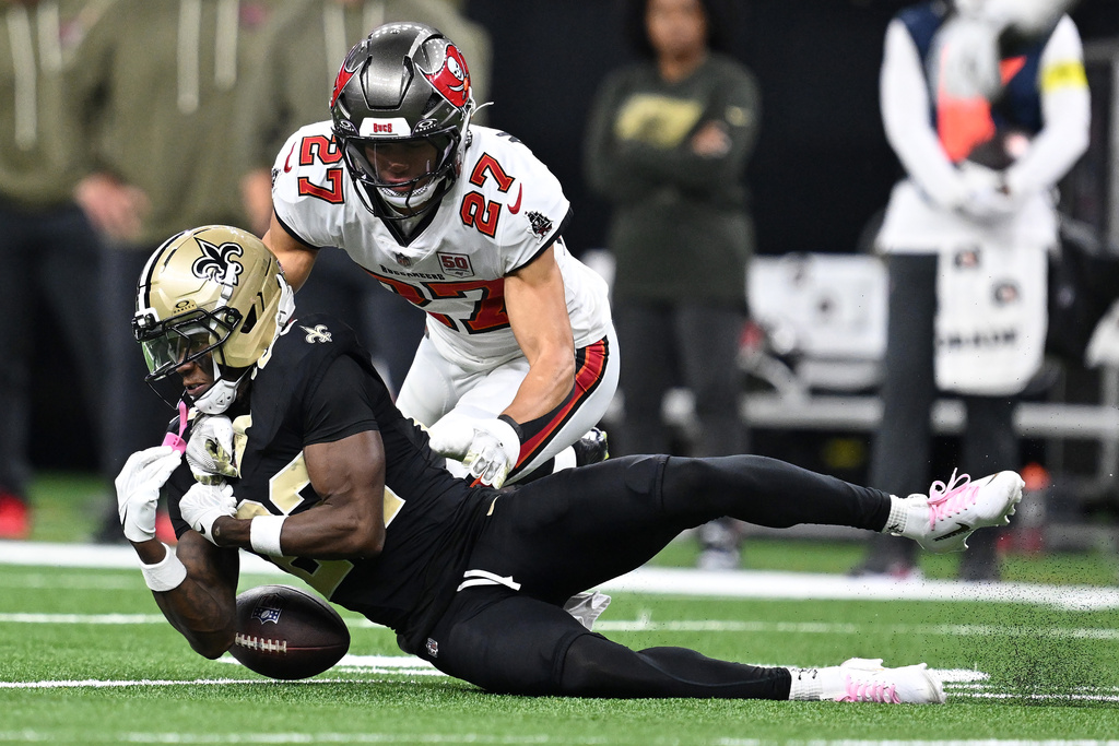 New Orleans Saints wide receiver Rashid Shaheed (22) can't hang onto the ball in front of Tampa Bay Buccaneers cornerback Zyon McCollum (27) during the second half of an NFL football game Sunday, Oct. 26, 2025, in New Orleans. (AP Photo/Ella Hall)