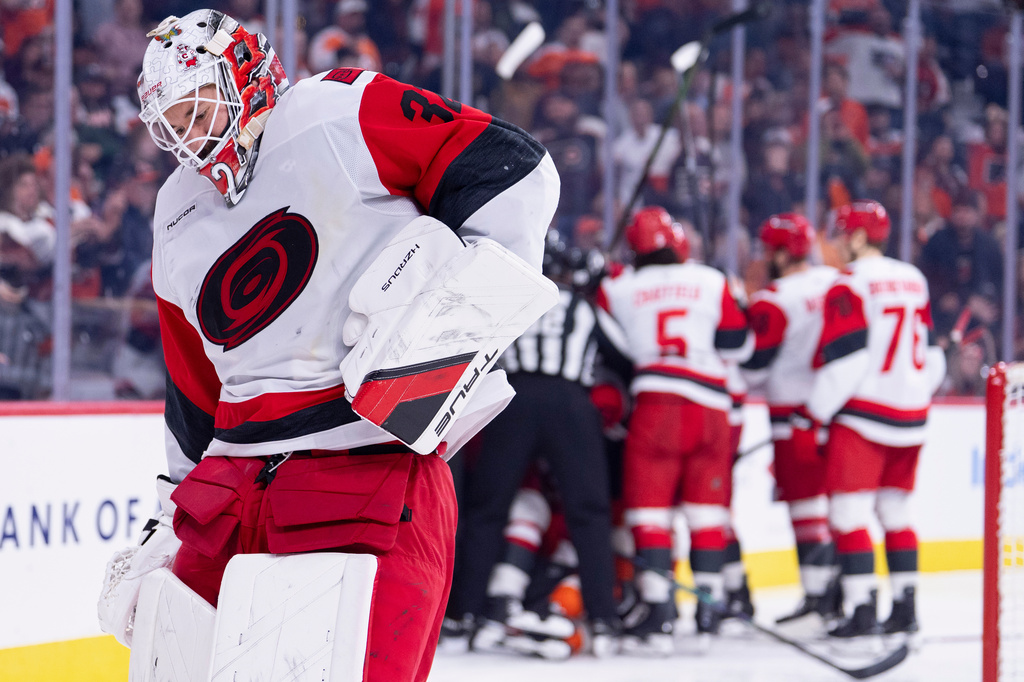 Carolina Hurricanes goalie Brandon Bussi reacts to the collision with Philadelphia Flyers right winger Owen Tippett during the second period of an NHL hockey game, Monday, April 13, 2026, in Philadelphia. (AP Photo/Chris Szagola)