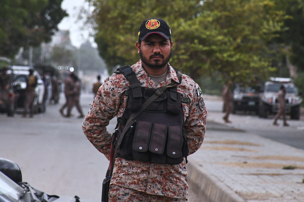 Paramilitary soldiers stand guard on a road cordoned off near the site of a militant attack at the provincial headquarters of the paramilitary Pakistan Rangers in Karachi, Pakistan, Sunday, June 28, 2026. (AP Photo/Ali Raza)