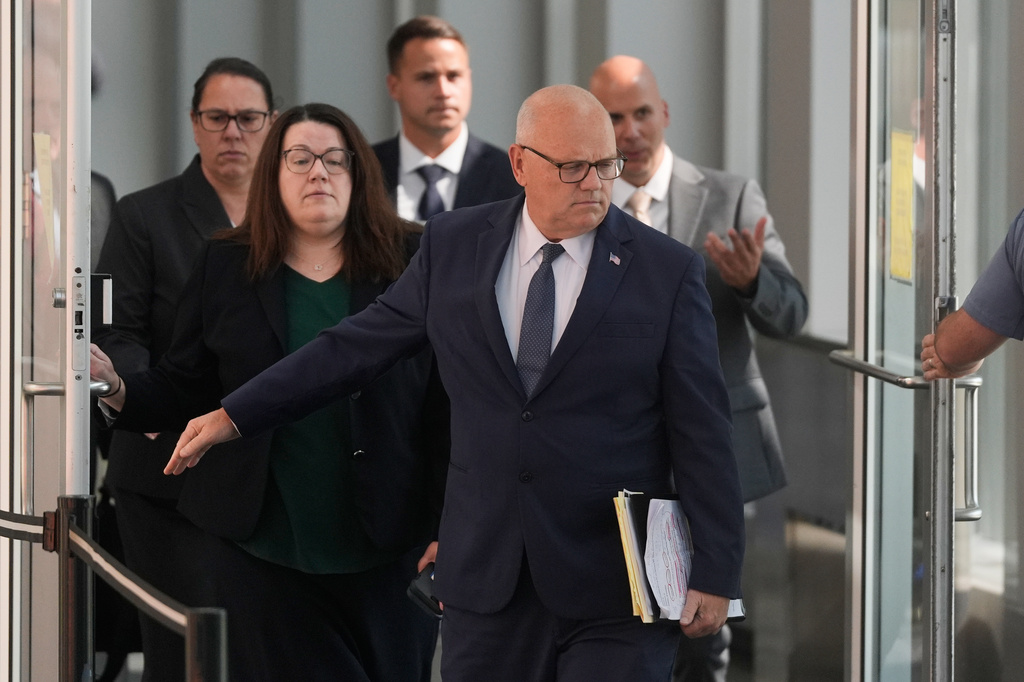 District Attorney for Plymouth County Timothy Cruz, front, leaves court after the judge declared a mistrial in Lindsay Clancy's murder trial at Plymouth County Superior Court, Friday, Sept. 4, 2026, in Plymouth, Mass. (AP Photo/Charles Krupa)