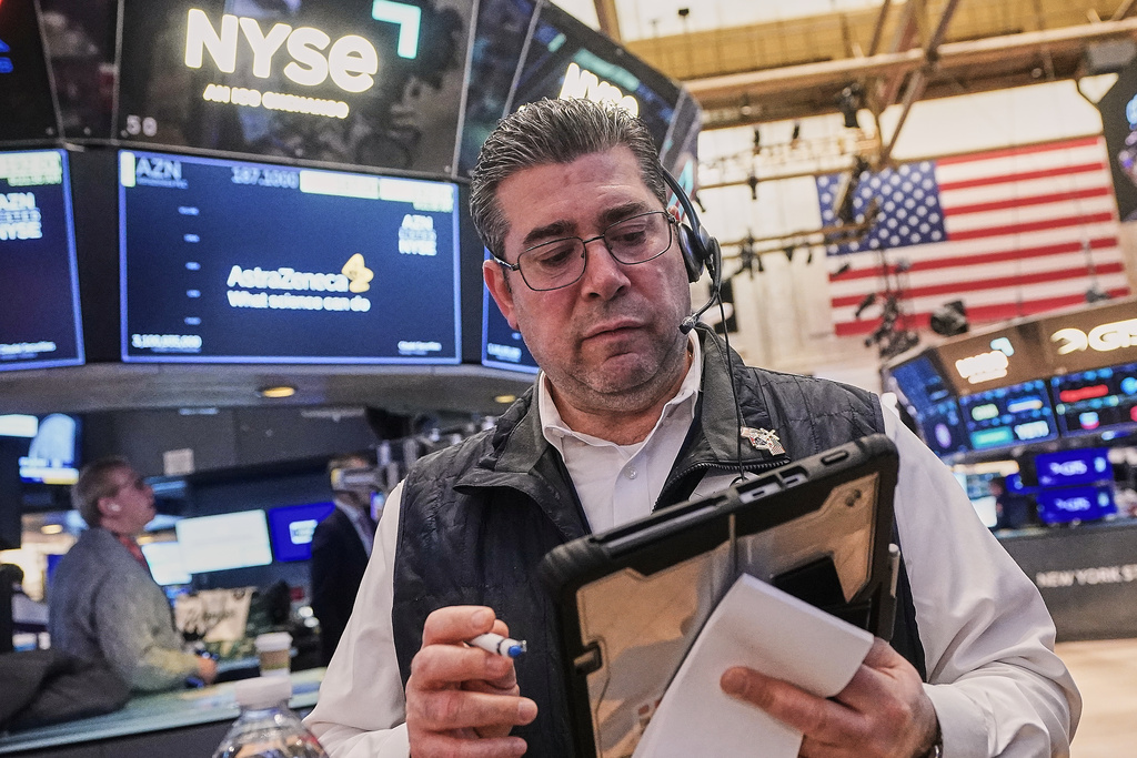 Trader Michael Capolino works on the floor of the New York Stock Exchange, Monday, Feb. 2, 2026. (AP Photo/Richard Drew)