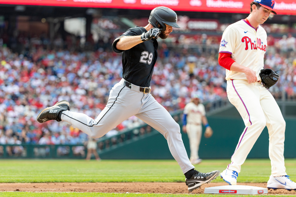 Chicago White Sox' Tristan Peters (29) is out at first as Philadelphia Phillies pitcher Andrew Painter touches the bag in the third inning of a baseball game, Saturday, June 6, 2026, in Philadelphia. (AP Photo/Laurence Kesterson)