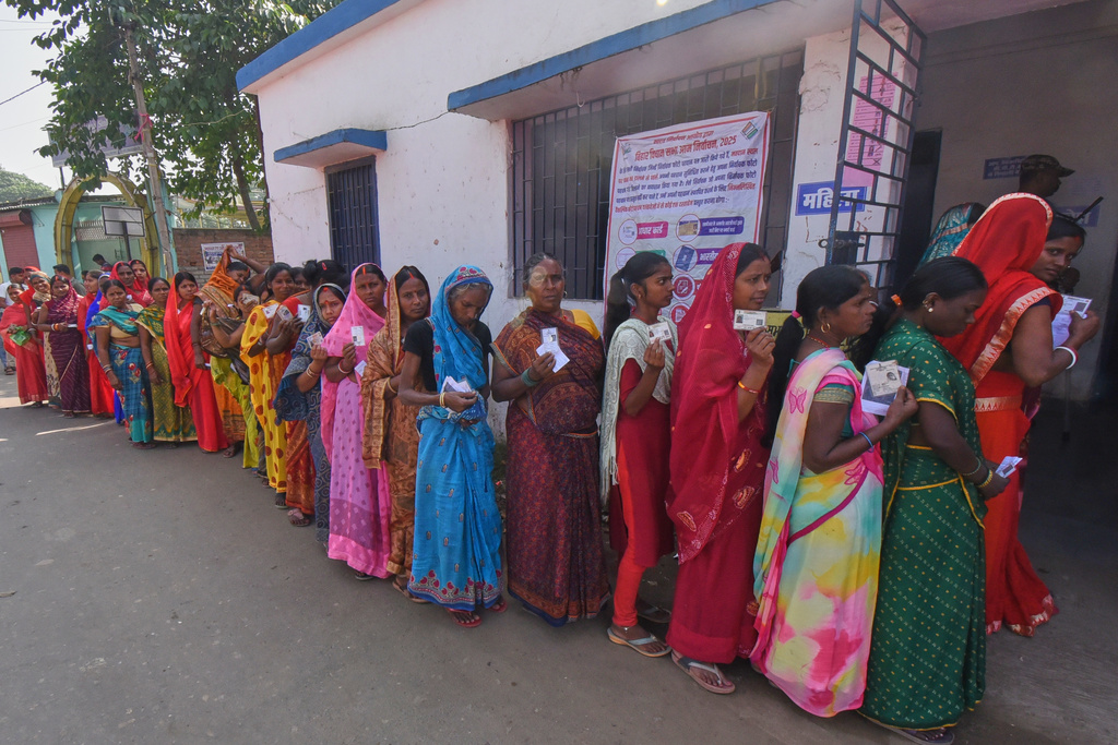 Women stand in a queue to cast their votes for Bihar state election at a polling booth in Patna, India, Thursday, Nov. 6, 2025. (AP Photo)