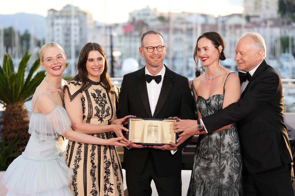 FILE - Director Joachim Trier, center, winner of the grand prix for the film "Sentimental Value," poses with Elle Fanning, from left, Inga Ibsdotter Lilleaas, Renate Reinsve and Stellan Skarsgard at the 78th international film festival, Cannes, southern France, on May 24, 2025. (Photo by Scott A Garfitt/Invision/AP, File)