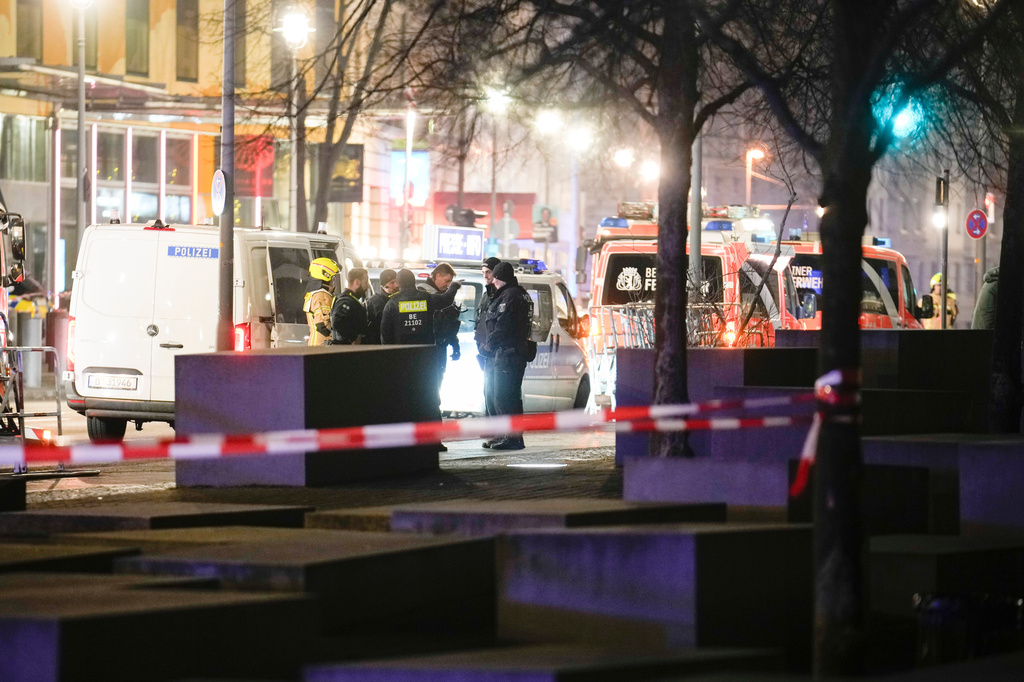 FILE - Emergency services attend the scene at the Holocaust memorial after a man was attacked at the memorial site in Berlin, Germany, Friday, Feb. 21, 2025. (AP Photo/Ebrahim Noroozi, file)