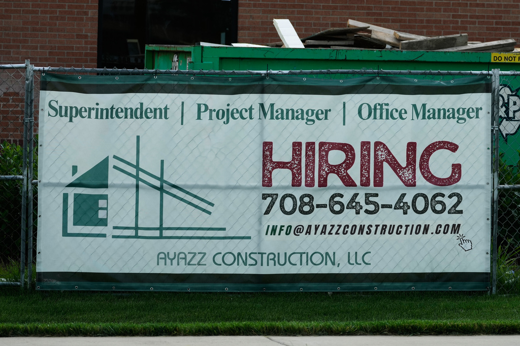 A hiring sign is seen in Buffalo Grove, Ill., Thursday, June 25, 2026. (AP Photo/Nam Y. Huh)