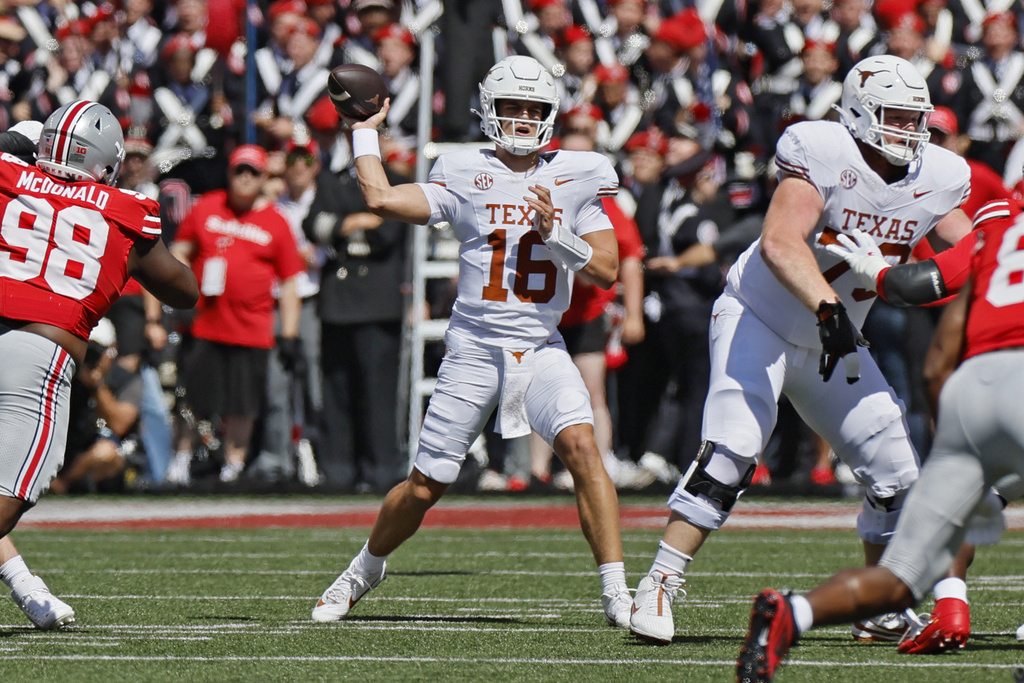 Texas quarterback Arch Manning throws a pass against Ohio State during the first half of an NCAA college football game, Saturday, Aug. 30, 2025, in Columbus, Ohio. (AP Photo/Jay LaPrete)