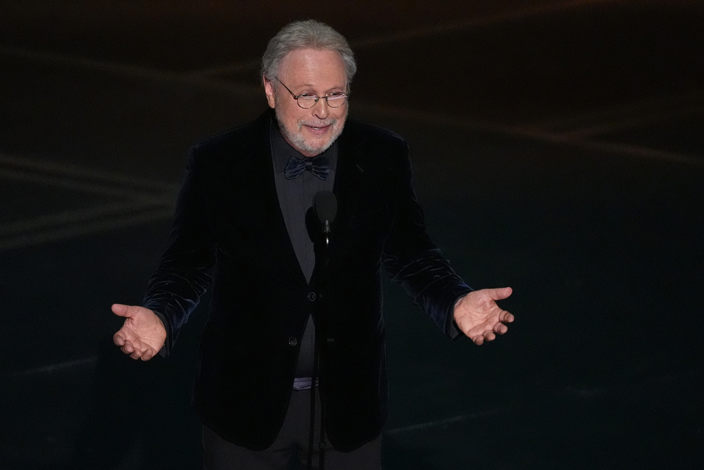 Billy Crystal presents a tribute about Rob Reiner and Michelle Singer Reiner during the Oscars on Sunday, March 15, 2026, at the Dolby Theatre in Los Angeles. (AP Photo/Chris Pizzello)