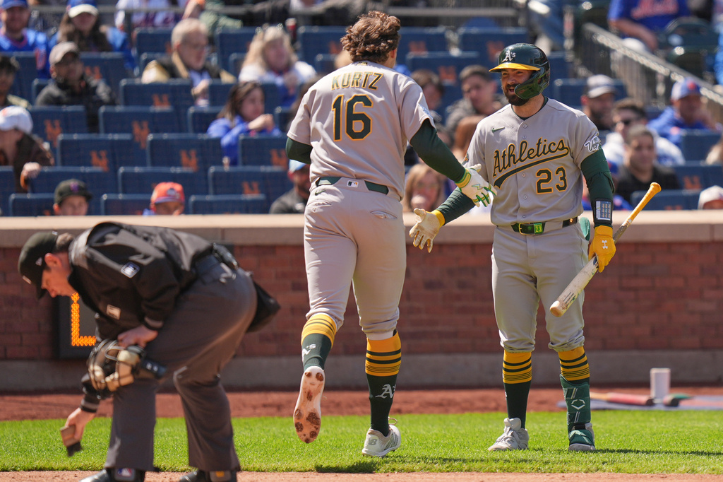 Oakland Athletics' Nick Kurtz (16) celebrates his solo home run with Shea Langeliers, right, during the third inning of a baseball game against the New York Mets, Sunday, April 12, 2026, in New York. (AP Photo/Seth Wenig)