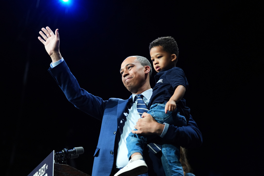 Democrat Jay Jones waves to the crowd on stage at an election night watch party for Democrat Abigail Spanberger after Jones was declared the winner of the Virginia attorney general's race Tuesday, Nov. 4, 2025, in Richmond, Va. (AP Photo/Stephanie Scarbrough)