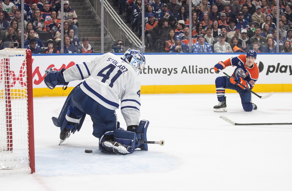 Toronto Maple Leafs' goalie Anthony Stolarz (41) makes a save on Edmonton Oilers' Ryan Nugent-Hopkins (93) during the second period of an NHL hockey game, in Edmonton, Alberta, Tuesday, Feb. 3, 2026. (Jason Franson/The Canadian Press via AP)