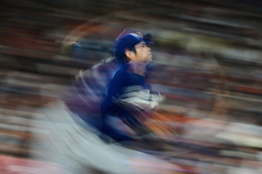 Los Angeles Dodgers starting pitcher Shohei Ohtani throws during the third inning of a baseball game against the Houston Astros in Houston, Tuesday, May 5, 2026. (AP Photo/Ashley Landis)
