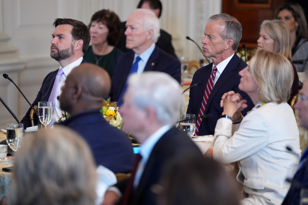 Senate Majority Leader John Thune, R-S.D., Vice President JD Vance and others, listen to President Donald Trump speak as they attend a breakfast with other Republicans in the State Dining Room of the White House, Wednesday, Nov. 5, 2025, in Washington. (AP Photo/Evan Vucci)