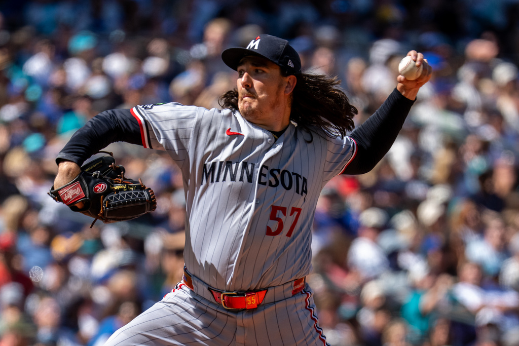Minnesota Twins reliever Kody Funderburk delivers a pitch during the seventh inning of a baseball game against the Seattle Mariners, Saturday, Aug. 1, 2026, in Seattle. (AP Photo/Stephen Brashear)
