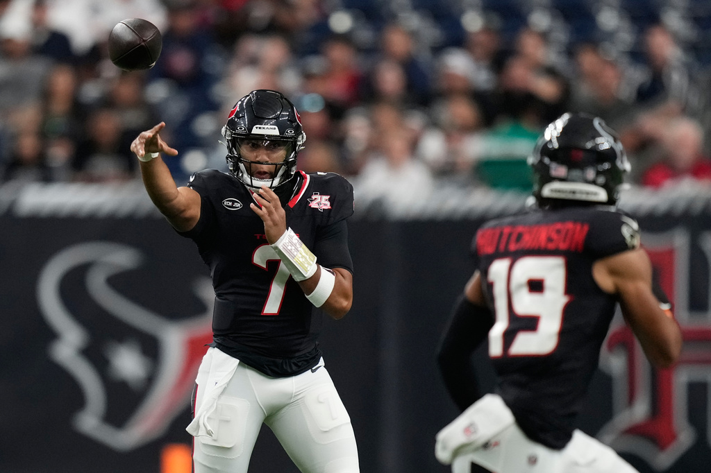 Houston Texans quarterback C.J. Stroud (7) throws to wide receiver Xavier Hutchinson (19) during the first half of an NFL preseason football game against the Las Vegas Raiders, Thursday, Aug. 20, 2026, in Houston. (AP Photo/Ashley Landis)