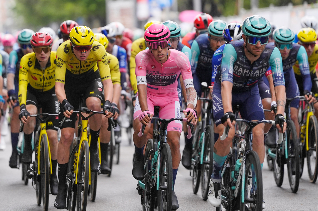Portugal's Afonso Oliveira Eulalio wears the pink jersey of the race overall leader as he pedals in the pack, during the 6th stage of the Giro d'Italia cycling race, from Paestum to Naples, Italy, Thursday, May 14, 2026. (Fabio Ferrari/LaPresse via AP)