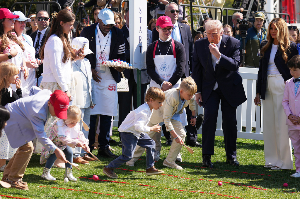 President Donald Trump and first lady Melania Trump participate in the White House Easter Egg Roll on the South Lawn of the White House, Monday, April 6, 2026, in Washington. (AP Photo/Mark Schiefelbein)