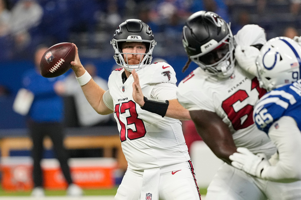 Atlanta Falcons quarterback Cooper Rush (13) throws against the Indianapolis Colts during the first half of an NFL football game in Indianapolis, Saturday, Aug. 22, 2026. (AP Photo/Nam Y. Huh)