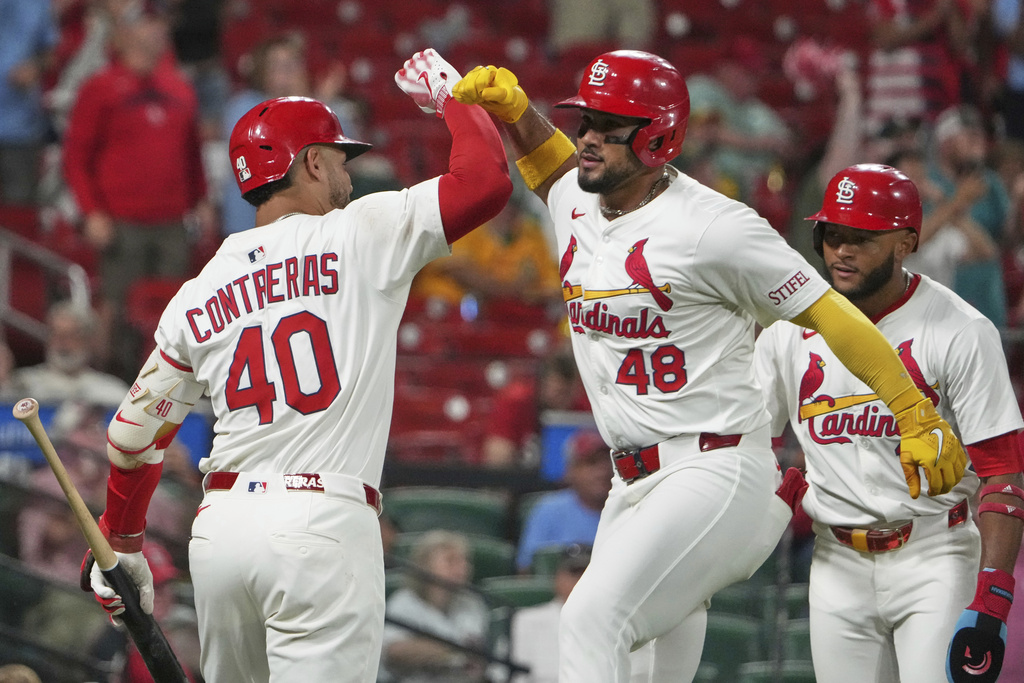 St. Louis Cardinals' Ivan Herrera (48) is congratulated by teammate Willson Contreras (40) after hitting a two-run home run during the sixth inning of a baseball game against the Athletics Tuesday, Sept. 2, 2025, in St. Louis. (AP Photo/Jeff Roberson)