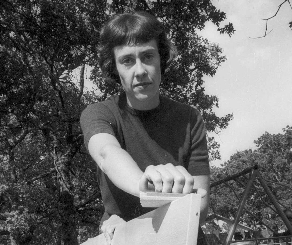 FILE - Ruth Paine sands shelves for a cooperative nursery school in her backyard in Irving, Texas. (AP Photo, File)