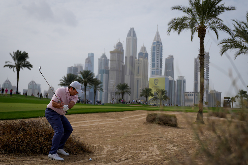 Francesco Molinari of Italy plays his second shot on the 8th hole during the final round of the Dubai Desert Classic in United Arab Emirates, Sunday, Jan. 25, 2026. (AP Photo/Altaf Qadri)