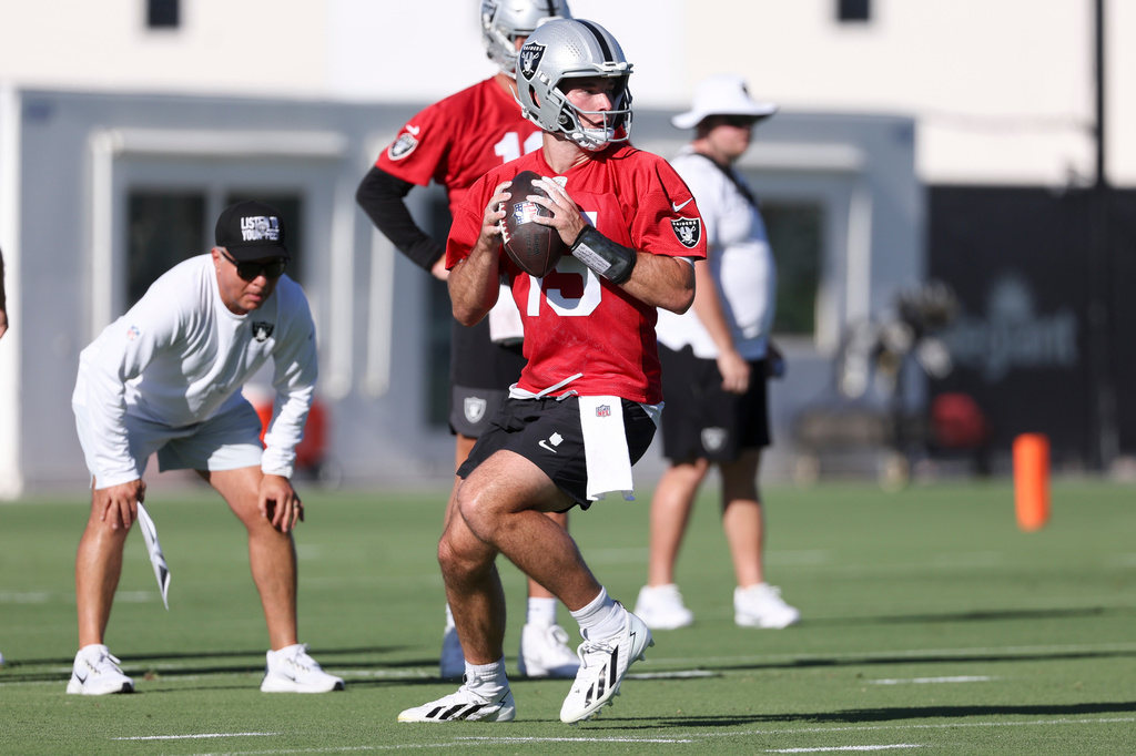 Las Vegas Raiders quarterback Fernando Mendoza (15) looks to pass during practice at the team's NFL football training camp, Thursday, July 30, 2026, in Henderson, Nev. (AP Photo/Ian Maule)
