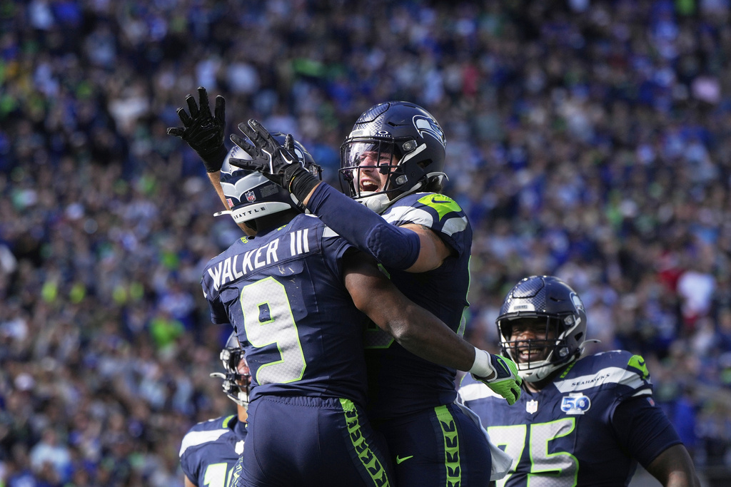 Seattle Seahawks running back Kenneth Walker III (9) celebrates his touchdown during the first half of an NFL football game against the New Orleans Saints, Sunday, Sept. 21, 2025, in Seattle. (AP Photo/Stephen Brashear)