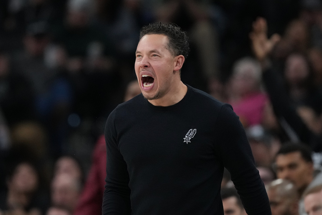 San Antonio Spurs head coach Mitch Johnson calls to his players during the first half of an NBA basketball game against the Portland Trail Blazers in San Antonio, Saturday, Jan. 3, 2026. (AP Photo/Eric Gay)