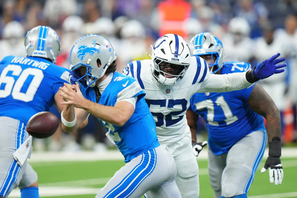 Indianapolis Colts defensive end George Gumbs Jr. (52) forces a fumble as he sacks Detroit Lions quarterback Luke Altmyer (2) during the second half of a preseason NFL football game in Indianapolis, Saturday, Aug. 29, 2026. (AP Photo/AJ Mast)