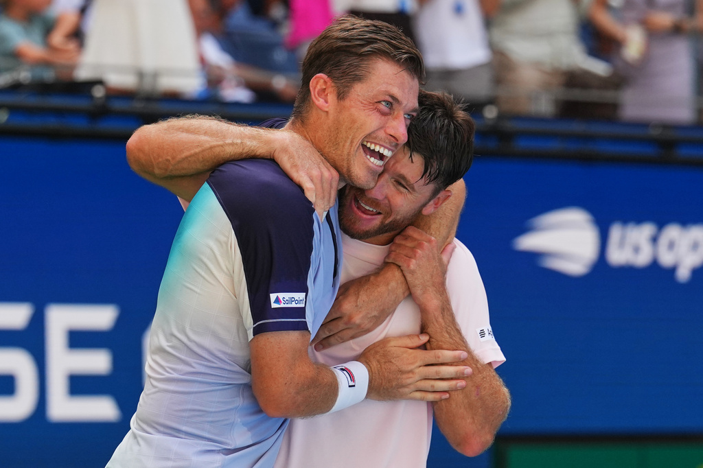 Neal Skupski, of Britain, left, celebrates with Christian Harrison, of the United States, right, after winning the men's doubles final of the U.S. Open tennis championships Kevin Krawietz, of Germany, and Tim Puetz, of Germany, Saturday, Sept. 12, 2026, in New York. (AP Photo/Kirsty Wigglesworth)