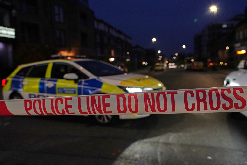 Police blocks a road in London, Monday, March 23, 2026 after an apparent arson attack on four vehicles belonging to a Jewish ambulance service, Hatzola Northwest, in London.(AP Photo/Alberto Pezzali)