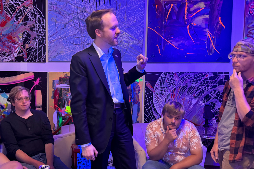 Republican State Rep. TJ Roberts, 28, talks during a meeting of young Republicans at a bar in Covington, Ky., Saturday, May 2, 2026. (AP Photo/Jesse Bedayn)