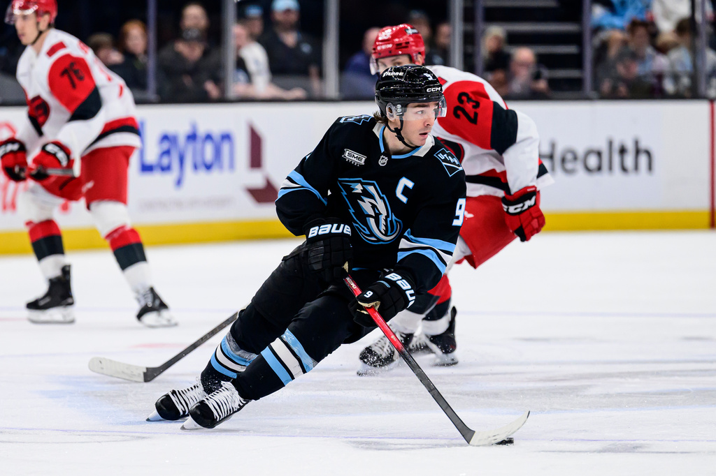 FILE - Utah Mammoth right wing Clayton Keller (9) skates with the puck during the third period of an NHL hockey game against the Carolina Hurricanes, April 11, 2026, in Salt Lake City. (AP Photo/Tyler Tate, File)