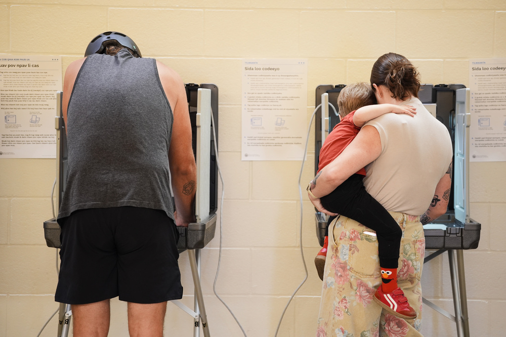 Voters cast their ballots on primary Election Day Tuesday, Aug. 11, 2026, in Minneapolis. (AP Photo/Ellen Schmidt)