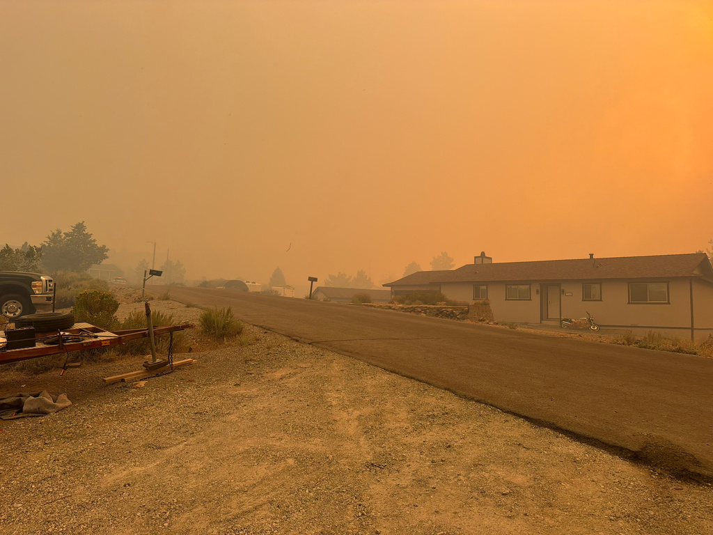 Smoke fills the air from the Hawk Fire Aug. 22, 2026, in northwet Reno, Nevada. (Shane Merritt via AP)
