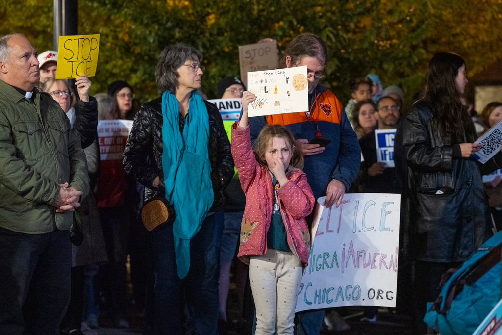 Hundreds of community members, parents, and elected officials attend a rally at Northcenter Town Square, in support of "Ms. Diana" an educator who was detained by federal law enforcement officers at Rayito de Sol Spanish Immersion Early Learning Center this morning, Wednesday, Nov. 5, 2025, in Chicago. (Tyler Pasciak LaRiviere/Chicago Sun-Times via AP)