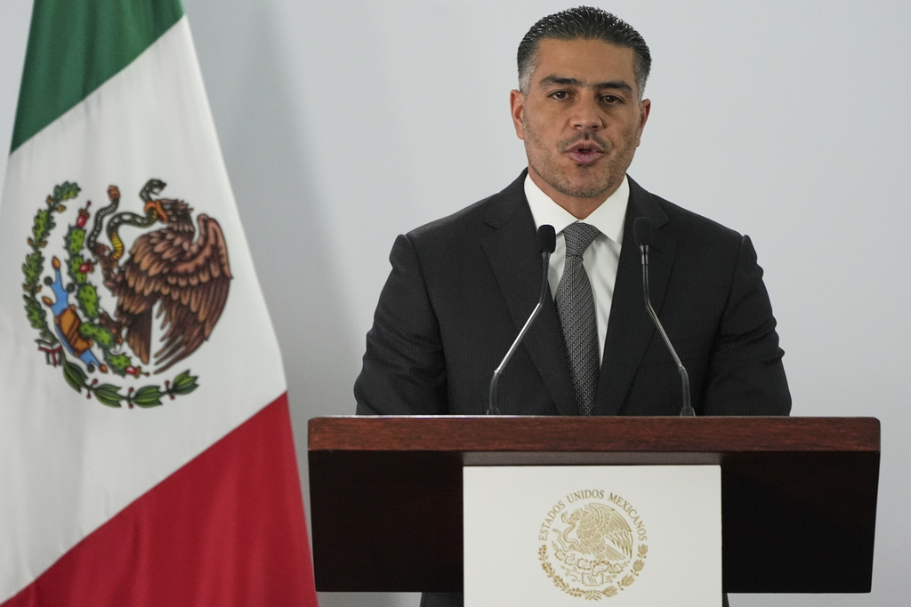 Mexican Security and Citizen Protection Minister Omar Garcia Harfuch gives a news conference about Mexico having sent 29 Mexican drug cartel figures to the U.S., in Mexico City, Wednesday, Aug. 13, 2025. (AP Photo/Fernando Llano)