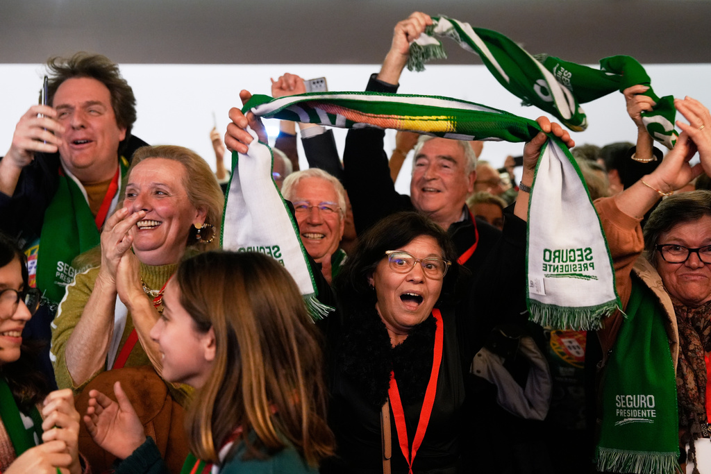Supporters of the center-left Socialist Party react to the first vote count results during Portugal's presidential election in Lisbon, Sunday, Feb. 8, 2026. (AP Photo/Ana Brigida)