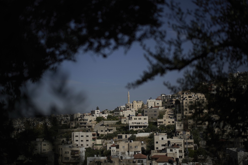 Houses and a mosque are visible in a section of the Jenin refugee camp in the West Bank, April 21, 2025. (AP Photo/Leo Correa)