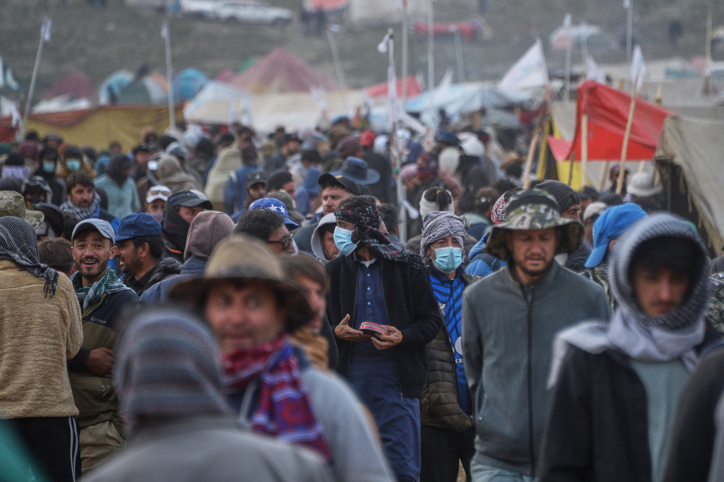 Spectators walk through a temporary tent settlement during the three-day annual Shandur Polo Festival in Shandur Pass, in the Ghizer district of Gilgit-Baltistan, northern Pakistan, Friday, June 12, 2026. (AP Photo/Zubair Abbasi)