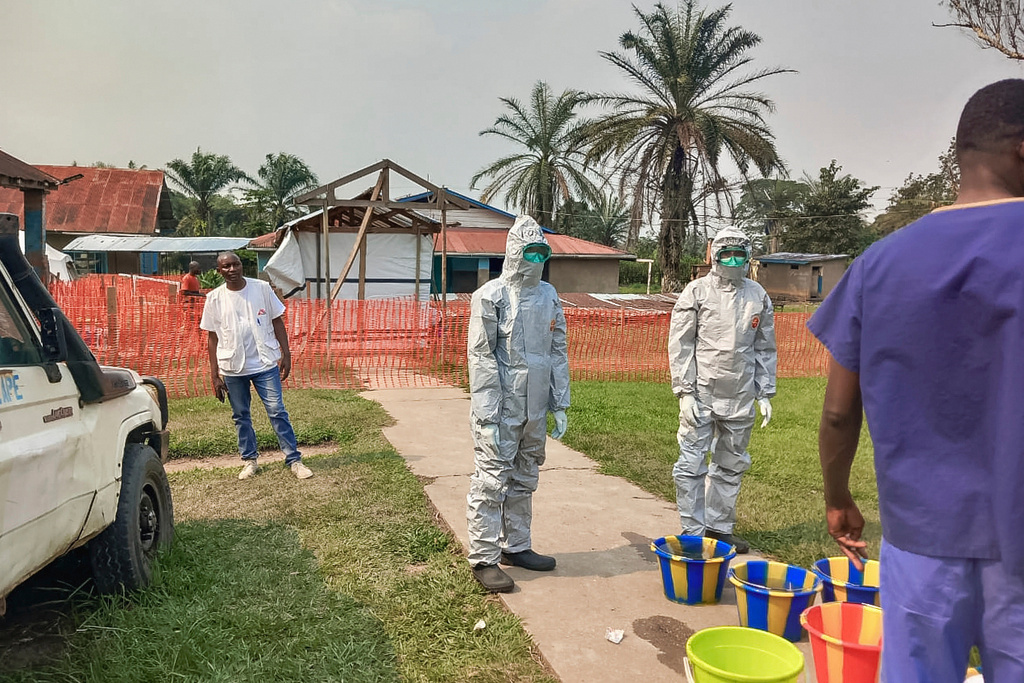 FILE - In this photo provided by Doctors Without Borders, men stand outside an Ebola treatment center in the remote Bulape Health Zone, Kasaï province, the Democratic Republic of Congo, Sept 7, 2025, that was set up following the outbreak of the Zaire strain of the Ebola virus. (MSF via AP, File)
