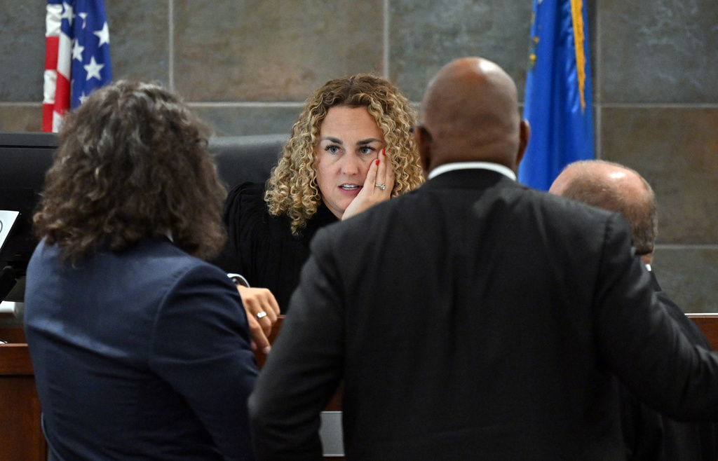 District Court Judge Carli Kierny, center, speaks with Duane Davis' attorney Michael Sanft, left, Chief Deputy District Attorneys Binu Palal, second from right, and Marc DiGiacomo during the first day of jury selection in Davis' murder trial related to the 1996 shooting death of rapper Tupac Shakur at the Regional Justice Center on Monday, Aug. 10, 2026, in Las Vegas. (David Becker/Pool Photo via AP)