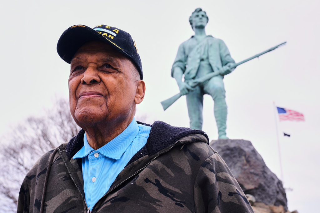 Revolutionary War re-enactor Charles Price, 95, who for decades portrayed enslaved Minuteman Prince Estabrook, poses for a portrait near the Minute Man statue, Monday, April 13, 2026, in Lexington, Mass. (AP Photo/Charles Krupa)